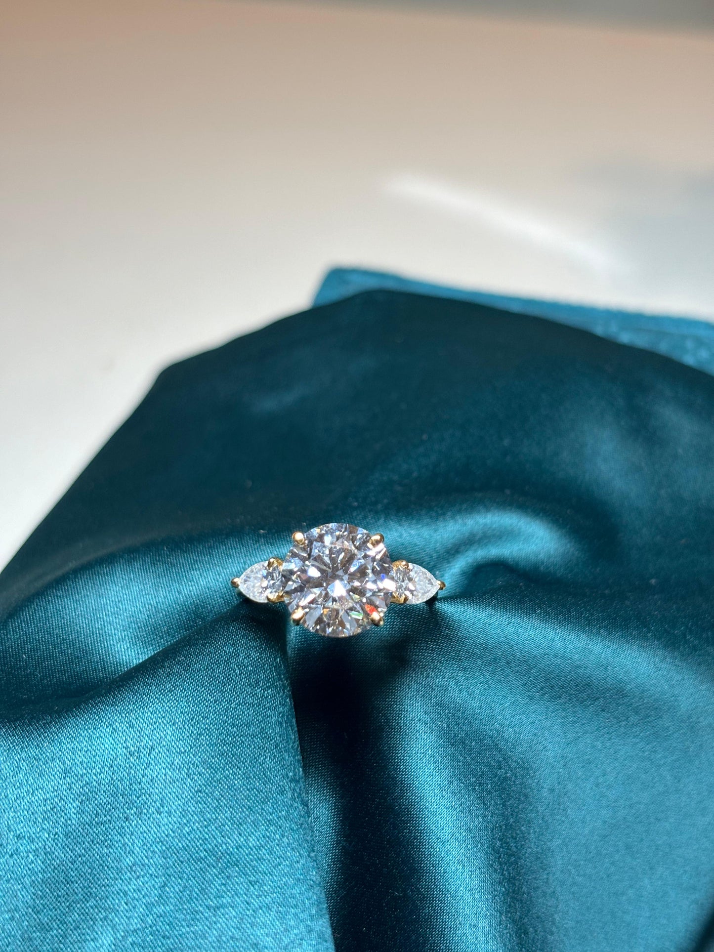 5 Carat Lab Grown Diamond with 50 Cent Each Pear on Sides on 18Kt Hallmarked Gold