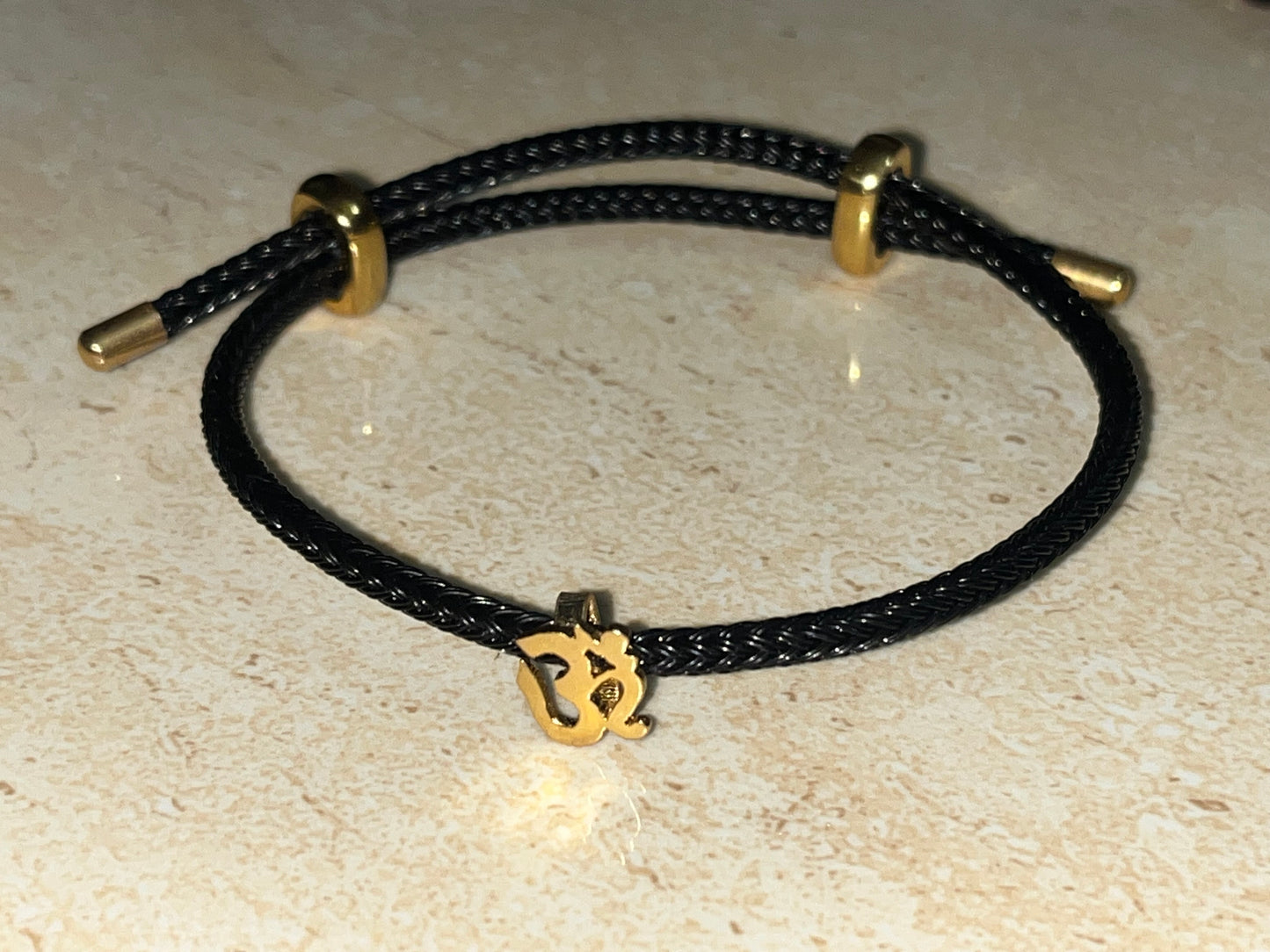 OM on Black Italian Leather Rope Jewel by Luxury Souvenir