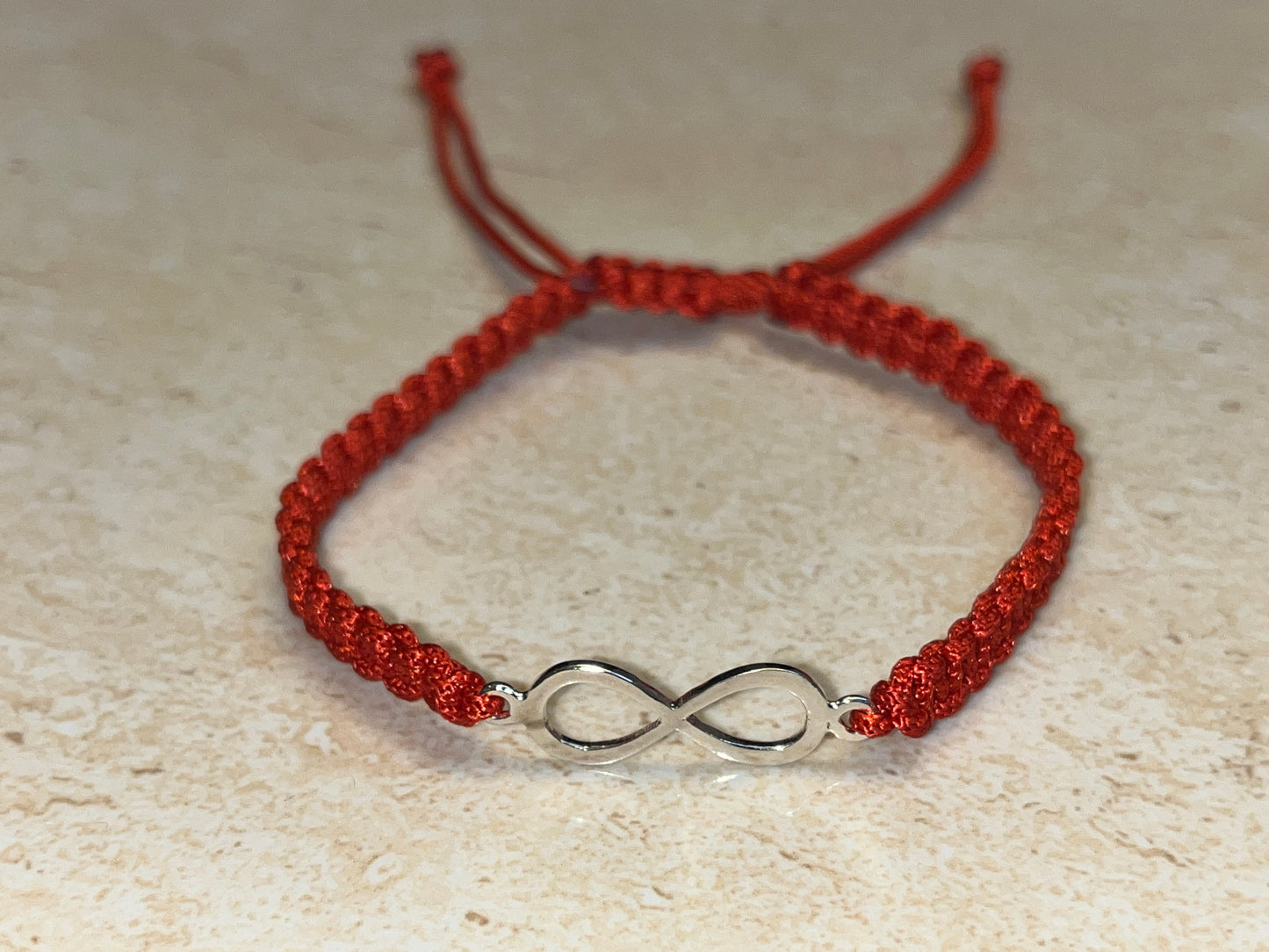 Infinity Bracelet on Red Adjutable Thread ( 925 Silver 24Kt Gold Plated )