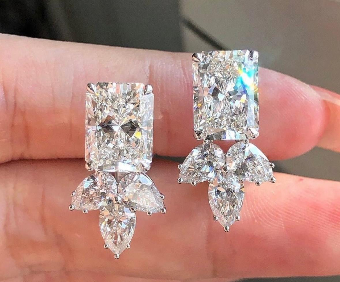 3 Carat Each Radiant Cut Lab Grown Diamond with supporting 50 cent each pear