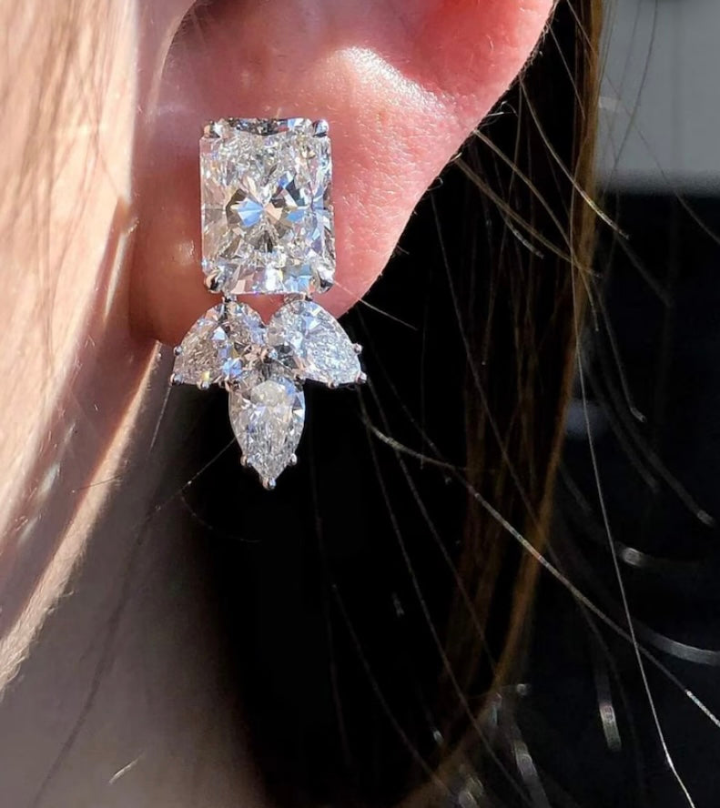 3 Carat Each Radiant Cut Lab Grown Diamond with supporting 50 cent each pear